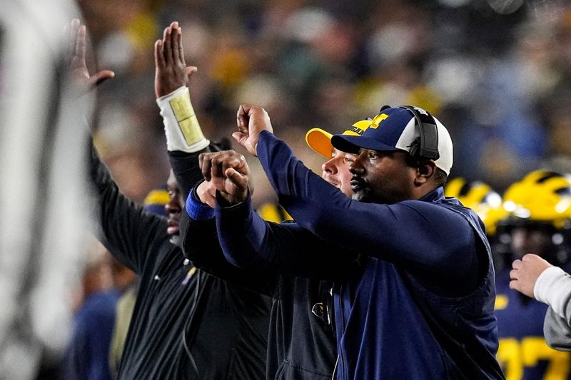 Michigan wide receivers coach Ron Bellamy reacts to a play against Purdue during the second half at Michigan Stadium in Ann Arbor on Saturday, November 1, 2025.