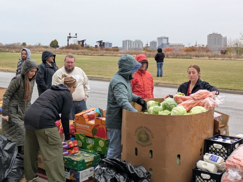 Volunteers lay out food at the YMCA to be distributed Monday, Nov. 3.