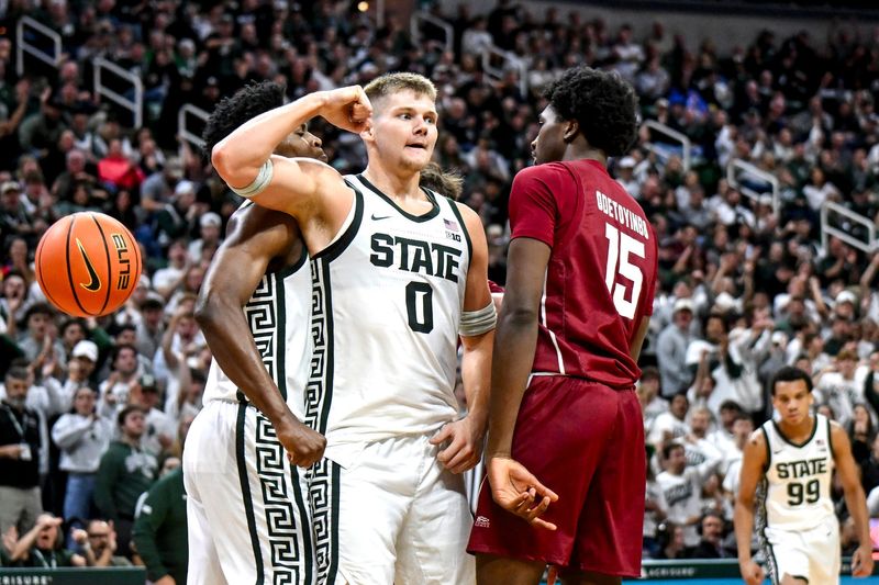 Michigan State's Jaxon Kohler, left, celebrates his score and drawing a Colgate foul during the second half on Monday, Nov. 3, 2025, at the Breslin Center in East Lansing.