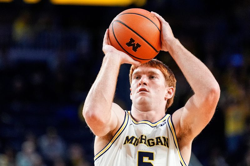 Michigan forward Oscar Goodman (5) attempts a free throw against Oakland during the second half at Crisler Center in Ann Arbor on Monday, November 3, 2025.