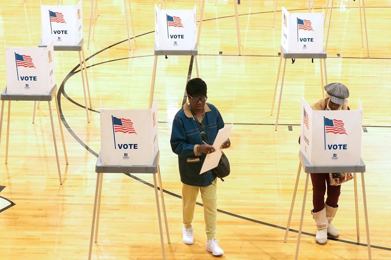 People vote at precinct nine in the gymnasium at the Kennedy School in Pontiac on Tuesday, Nov 4, 2025.