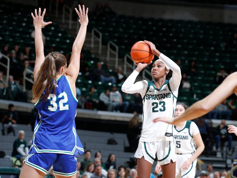 Michigan State's Jalyn Brown, right, shoots against Mercyhurst's Erica Hall (32), Tuesday, Nov. 4, 2025, in East Lansing.