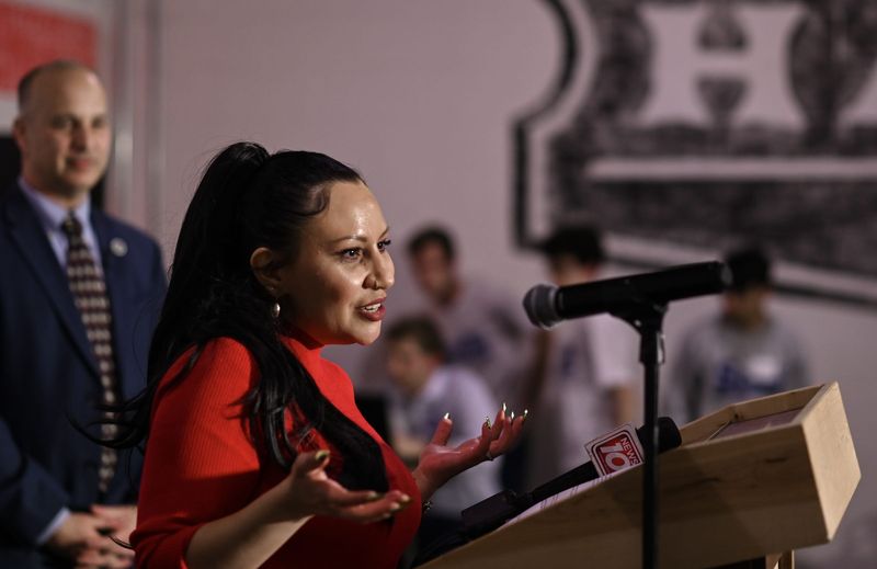 Lansing City Council Ward 2 candidate Deyanira Nevarez Martinez speaks Tuesday, Nov. 4, 2025, during an election watch party at Lansing Brewing Company in Lansing, as Lansing Mayor Andy Schor looks on.