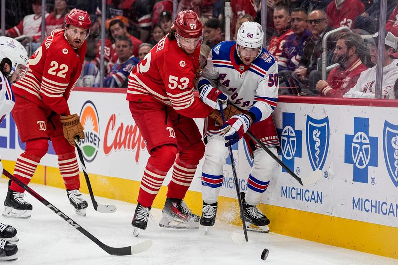 Detroit Red Wings defenseman Moritz Seider (53) defends New York Rangers left wing Will Cuylle (50) during the second period at Little Caesars Arena in Detroit on Friday, November 7, 2025.