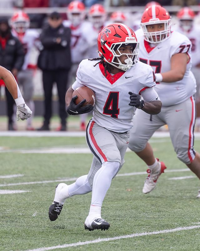 East Kentwood's Ahman Edmonds bursts into the open field during a victory over Howell Saturday, Nov. 8, 2025. Edmonds finished with over 270 yards receiving and three scores, with Kentwood now set to face Hudsonville in regionals.