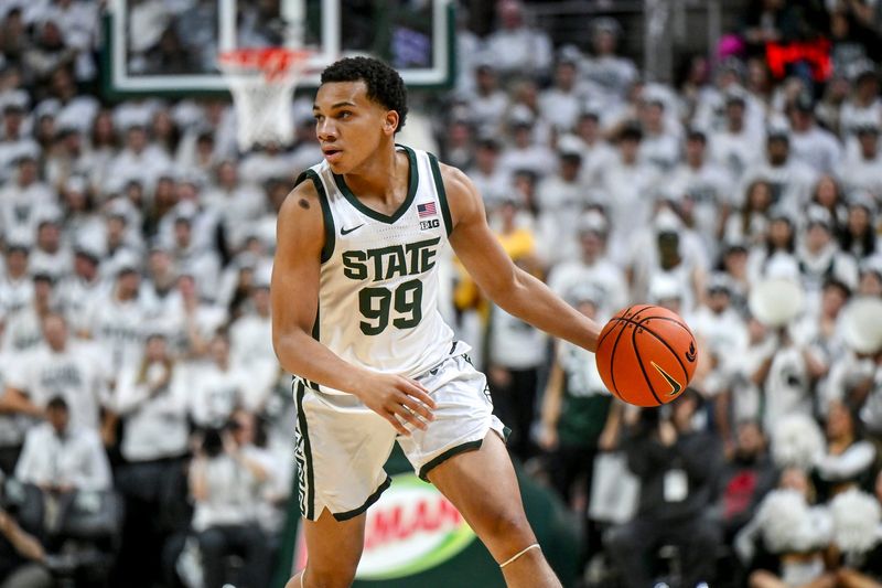 Michigan State's Divine Ugochukwu moves the ball against Arkansas during the first half on Saturday, Nov. 8, 2025, at the Breslin Center in East Lansing.