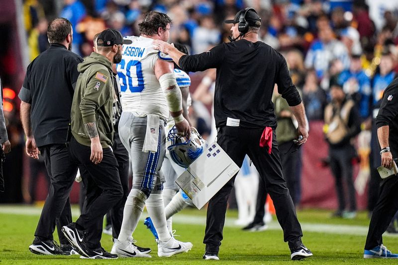 Detroit Lions guard Graham Glasgow (60) walks off the field due to an injury during the first half against Washington Commanders at Northwest Stadium in Landover, Md. on Sunday, November 9, 2025.