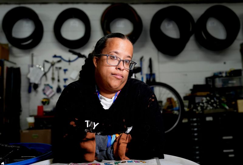 Taria Sims, 32, of Lincoln Park, at her job at Programs to Educate All Cyclists on Friday, Nov. 7, 2025, where she is a bike mechanic.
Sims uses the SMART bus at the stop behind JCPenny at Southland Center in Taylor, but starting on Monday, Nov. 10, the buses will no longer stop at this location leaving people like Sims dependent on this stop to find a different SMART bus stop.