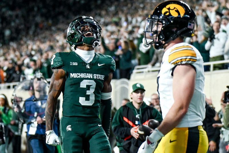 Michigan State's Montorie Foster Jr., left, celebrates his touchdown catch against Iowa during the third quarter on Saturday, Oct. 19, 2024, at Spartan Stadium in East Lansing.
