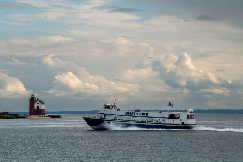 A Shepler's ferry cruises past the Round Island Lighthouse in the Straits of Mackinac near Mackinac Island on Wednesday, Sept. 24, 2025. A federal judge has ruled in favor of the company that owns Shepler's and Arnold Transit in an antitrust suit.