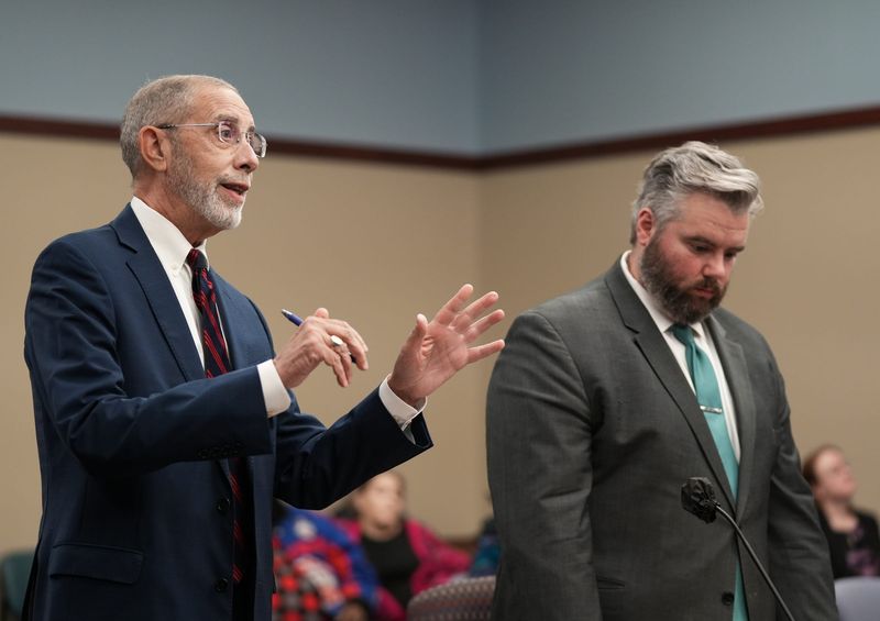 Joseph Abood, deputy city attorney for the city of Lansing, on the left, and Matthew Staples, an assistant city attorney, address Ingham County Circuit Judge Rosemarie Aquilina, Wednesday, Nov. 12, 2025, about the ongoing battle between the City of Lansing and a homeless encampment on private property near Dietrich Park in Lansing.
