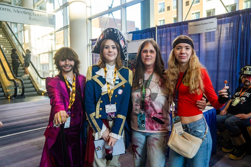 Ari Sypek and Ella Danforth (left to right) went the Hamilton the musical route while McKenzie Spencer and Mattie Swanson dressed up as a Last of Us zombie and Johnny Lawrence from Karate Kid on Nov. 8, 2025.
