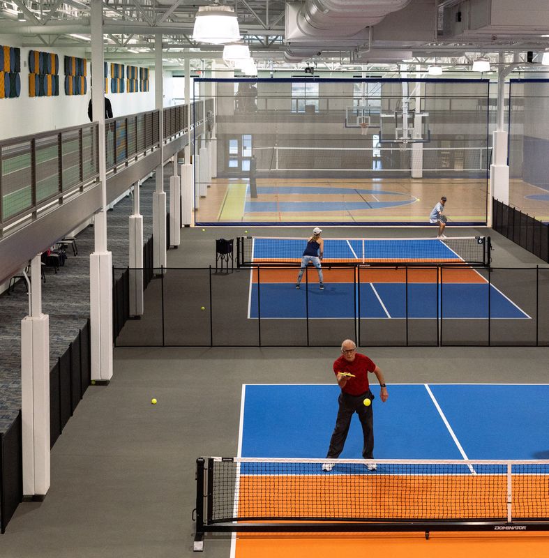 Players compete in a pickleball league inside the new Holland Township Community Center.