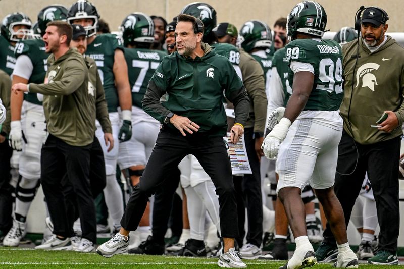 Michigan State's defensive coordinator Joe Rossi celebrates after a Spartans sack against Penn State during the first quarter on Saturday, Nov. 15, 2025, at Spartan Stadium in East Lansing.