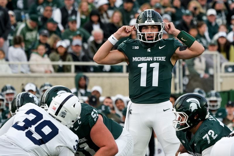 Nov 15, 2025; East Lansing, Michigan, USA; Michigan State Spartans quarterback Alessio Milivojevic (11) calls an audible in the second quarter against the Penn State Nittany Lions at Spartan Stadium. Mandatory Credit: Brendan Mullin-Imagn Images