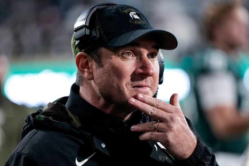Nov 15, 2025; East Lansing, Michigan, USA; Michigan State head coach Jonathan Smith watches his team play against Penn State from the sidelines in the third quarter at Spartan Stadium. Mandatory Credit: Brendan Mullin-Imagn Images