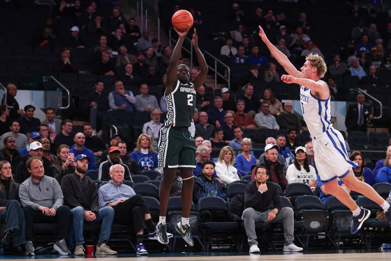 Michigan State Spartans guard Kur Teng (2) shoots the ball as Kentucky Wildcats guard Collin Chandler (5) defends during the first half at Madison Square Garden in New York on Tuesday, Nov. 18, 2025.