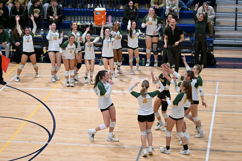 Flat Rock's volleyball team celebrates after Sarah Giroux's third consecutive ace during a 25-5, 25-11, 25-8 victory over Ferndale in the Division 2 state quarterfinals on Tuesday, Nov. 18, 2025.