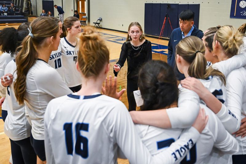 Skyline head coach Linsey Momrik, center, speaks with the team during their Div. 1 state quarterfinal loss to Byron Center on Tuesday, Nov. 18, 2025 at Gull Lake High School in Richland, Michigan.