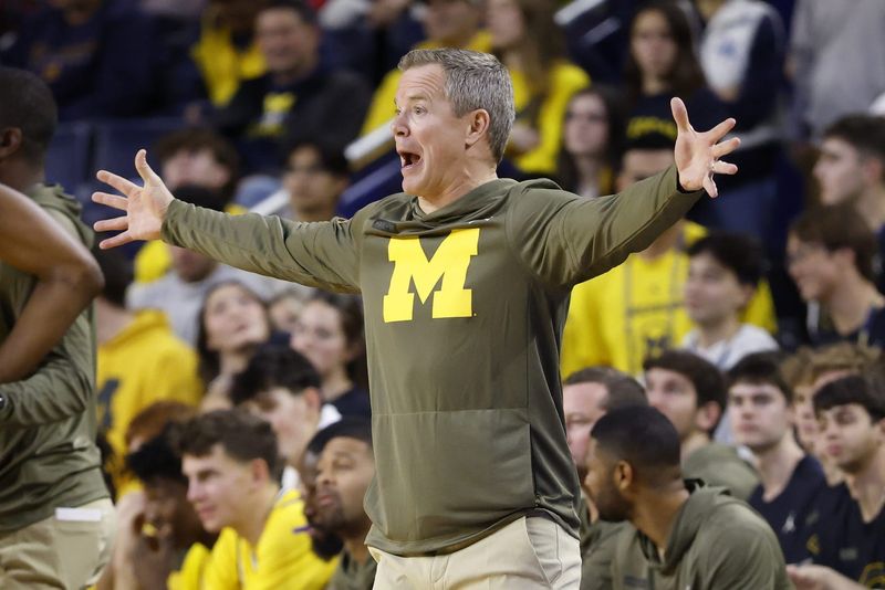 Nov 19, 2025; Ann Arbor, Michigan, USA; Michigan Wolverines head coach Dusty May reacts in the first half against the Middle Tennessee Blue Raiders at Crisler Center. Mandatory Credit: Rick Osentoski-Imagn Images