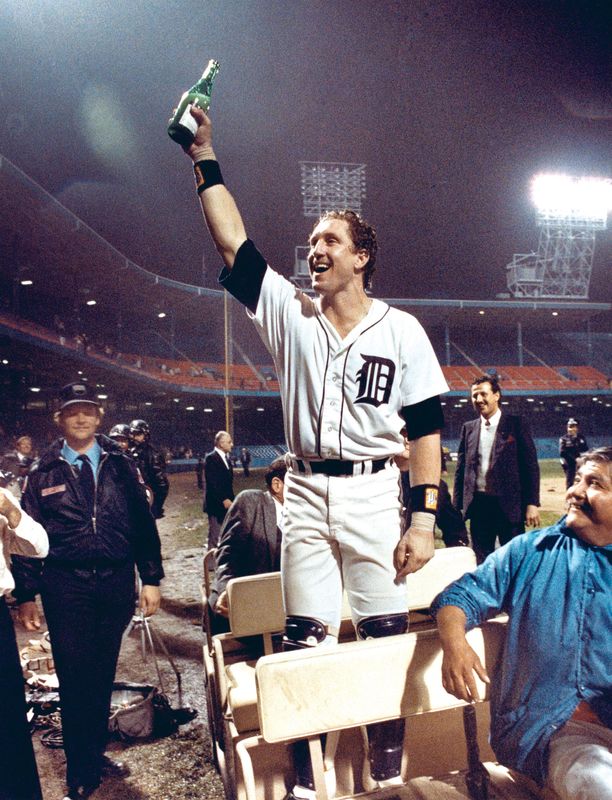 Detroit Tiges catcher Lance Parrish raises his bottle of champagne to the fans still in the stands long after the Detroit Tigers won the 1984 World Series at Tiger Stadium in Detroit on October 14, 1984.