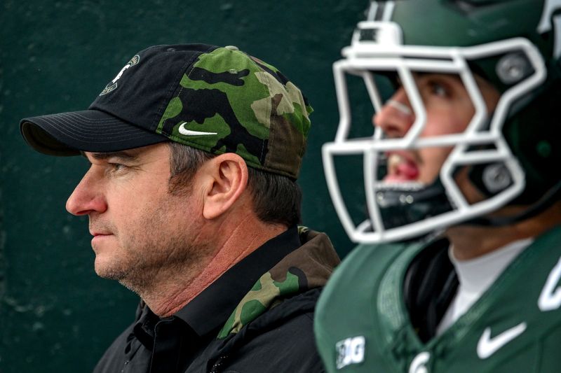 Michigan State's head coach Jonathan Smith prepares to take the field with the team before the game against Penn State on Saturday, Nov. 15, 2025, at Spartan Stadium in East Lansing.