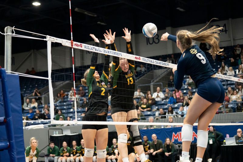 Flat Rock juniors Hannah Hesse and Lily Klein block during the Division 2 Final against Detroit Country Day at Kellogg Arena in Battle Creek on Saturday, Nov. 22, 2025.