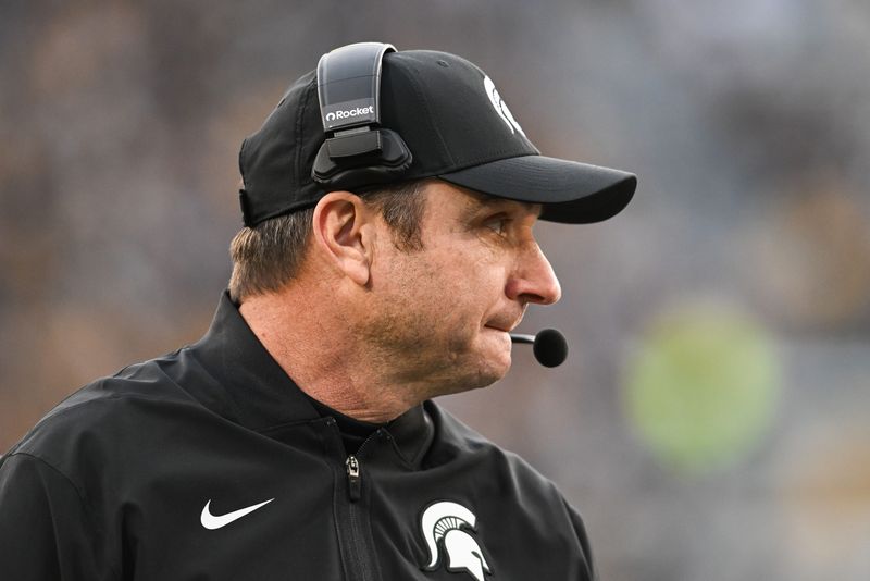 Nov 22, 2025; Iowa City, Iowa, USA; Michigan State Spartans head coach Jonathan Smith looks on during the second quarter against the Iowa Hawkeyes at Kinnick Stadium. Mandatory Credit: Jeffrey Becker-Imagn Images