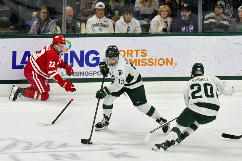 Michigan State's Tiernan Shoudy (13) looks to pass against Wisconsin at Munn Arena Saturday, Nov. 22, 2025.