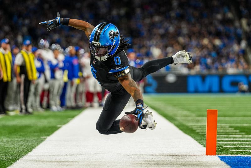 Detroit Lions running back Jahmyr Gibbs (0) makes a catch for a touchdown in the second quarter against the New York Giants at Ford Field in Detroit on Sunday, Nov. 23, 2025.