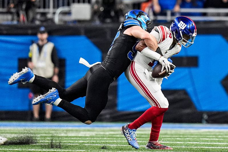 Detroit Lions defensive end Aidan Hutchinson (97) sacked New York Giants quarterback Jameis Winston (19) during the overtime at Ford Field in Detroit on Sunday, Nov. 23, 2025.