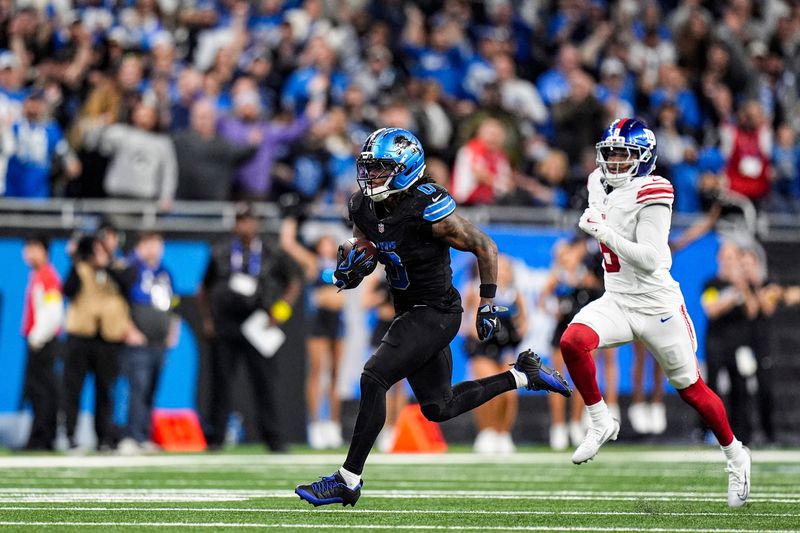 Detroit Lions running back Jahmyr Gibbs (0) runs against New York Giants during overtime at Ford Field in Detroit on Sunday, Nov. 23, 2025.
