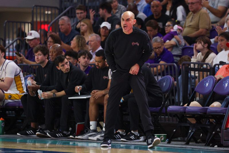 Nov 25, 2025; Fort Myers, Florida, USA; East Carolina Pirates head coach Michael Schwartz reacts after a play against the Michigan State Spartans in the second half at Suncoast Credit Union Arena. Mandatory Credit: Nathan Ray Seebeck-Imagn Images