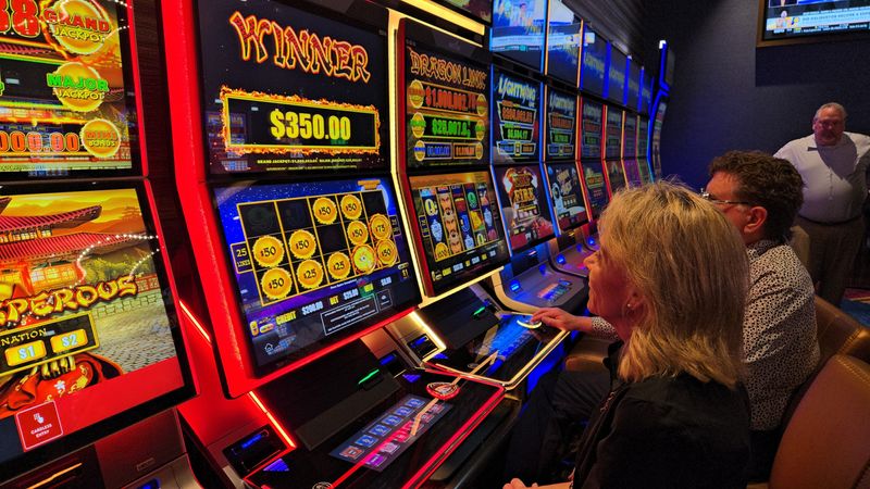 Hard Rock Casino Rockford patrons play the casino's high roller million dollar Dragon Link progressive jackpot slot machine on Thursday, May 22, 2025.