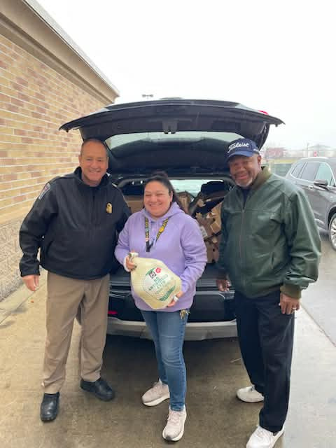 From left to right, Lansing Township Police Chief John Joseph, Sam's Club Manager Raquel Rocha, and Robinson Memorial Church of God in Christ Pastor Michael West. Joseph and West were visiting Sam's Club to pick up 40 turkeys.