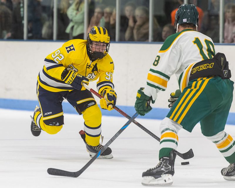 Hartland's Brayden Stephens (92) brings the puck up the ice against Howell's Chad Pietila Wednesday, Nov. 26, 2025.