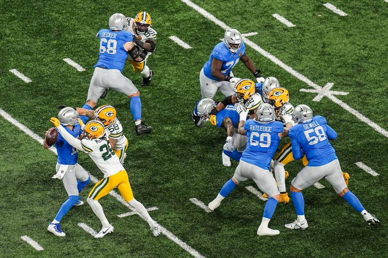 Detroit Lions quarterback Jared Goff (16) is sacked during the first quarter by the Green Bay Packers at Ford Field in Detroit on Thursday, Nov. 26, 2025.