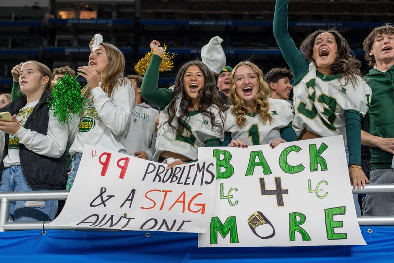 Jackson Lumen Christi fans cheers during the second half of the MHSAA Division 6 football state championship game against Kingsley at Ford Field in Detroit on Friday, Nov. 28, 2025.