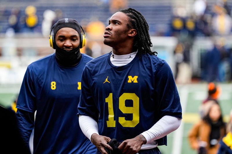 Michigan quarterback Bryce Underwood (19) looks on after warms up at Michigan Stadium in Ann Arbor on Saturday, Nov. 29, 2025.
