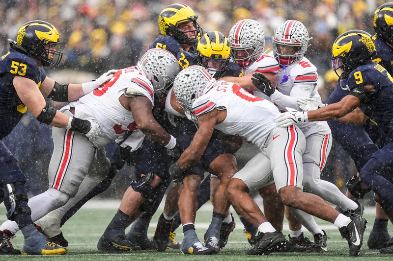 Michigan running back Jordan Marshall (23) runs against Ohio State during the second half at Michigan Stadium in Ann Arbor on Saturday, Nov. 29, 2025.