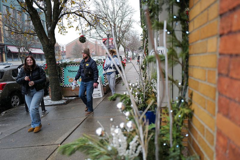 People shop on Small Business Saturday in Lansing's Old Town Saturday, Nov. 29, 2025.