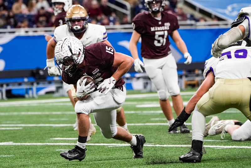 Menominee running back Clayton Miller (15) runs against Schoolcraft during the first half of MHSAA Division 7 final at Ford Field in Detroit on Sunday, Nov. 30, 2025.
