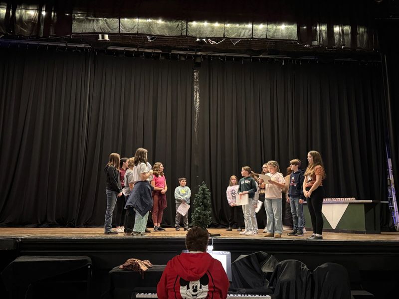 Cast members rehearse for an upcoming production of "A Charlie Brown Christmas" at the Soo Theatre.
