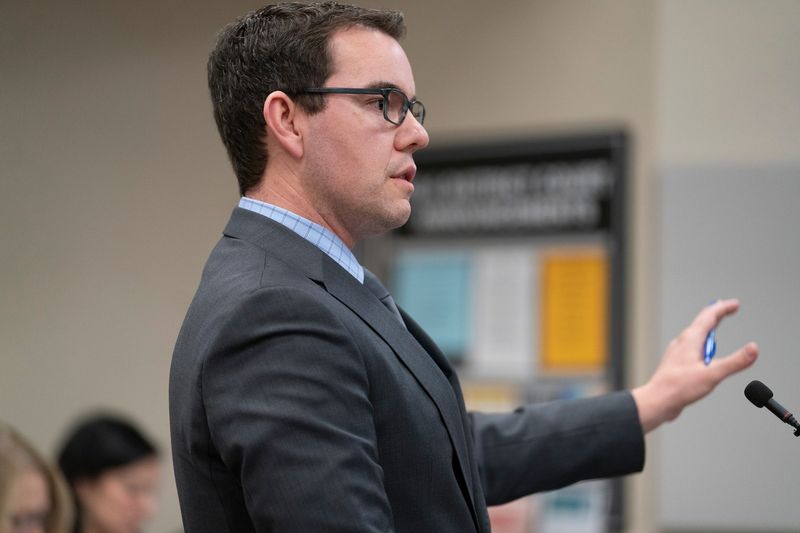 Assistant Michigan Attorney General Christopher Kessel questions witness Troy police detective Ryan Whitehead as the founder and CEO of the Oxford Center, Tamela Peterson, and employees Gary Marken, Jeffrey Mosteller and Aleta Harward Moffitt are all criminally charged in the Jan. 31 death of Thomas Cooper, 5, inside a hyperbaric oxygen chamber at the center in Troy. They are appearing for a preliminary examination of the evidence on Tuesday, Dec. 2, 2025 in 52-4 District Court in Troy before Judge Maureen M. McGinnis, who will determine whether they should be bound over to trial.