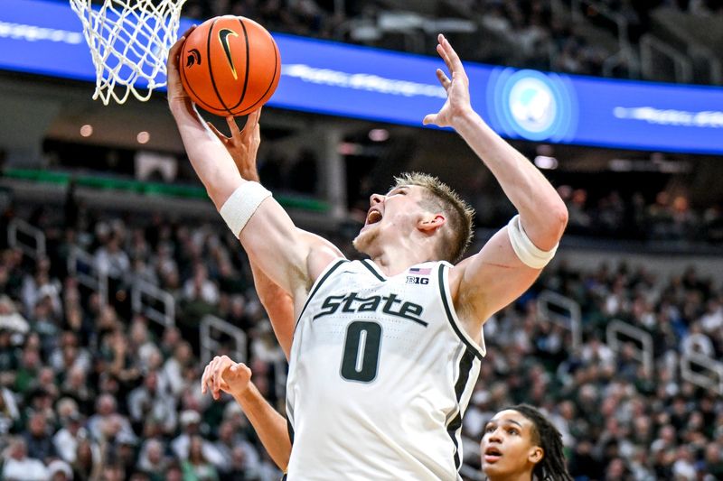 Michigan State's Jaxon Kohler pulls down a rebound against Iowa during the second half on Tuesday, Dec. 2, 2025, at the Breslin Center in East Lansing.