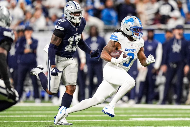 Detroit Lions running back Jahmyr Gibbs (0) runs against Dallas Cowboys during the first half at Ford Field in Detroit on Thursday, Dec. 4, 2025.