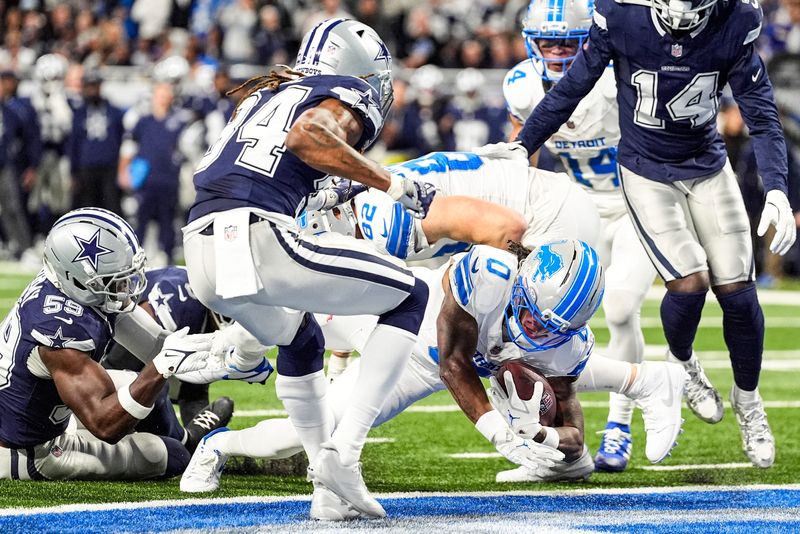 Detroit Lions running back Jahmyr Gibbs (0) runs for a touchdown against Dallas Cowboys during the first half at Ford Field in Detroit on Thursday, Dec. 4, 2025.