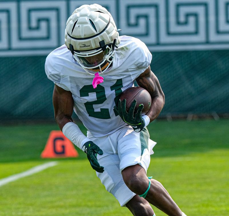 Michigan State's Tracy Revels (21) runs the ball at practice Tuesday, Aug. 5, 2025.