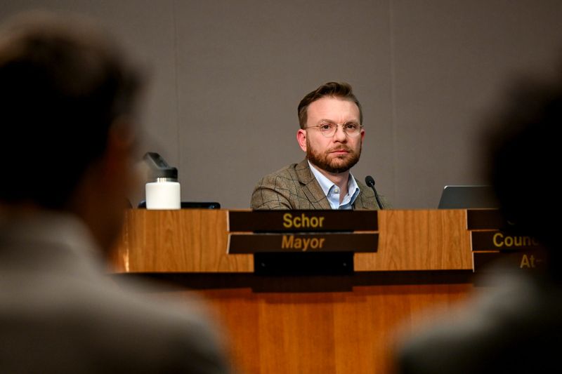 Councilmember Peter Spadafore listens to a presentation during a city council meeting on Monday, Dec. 8, 2025, at city hall in Lansing.