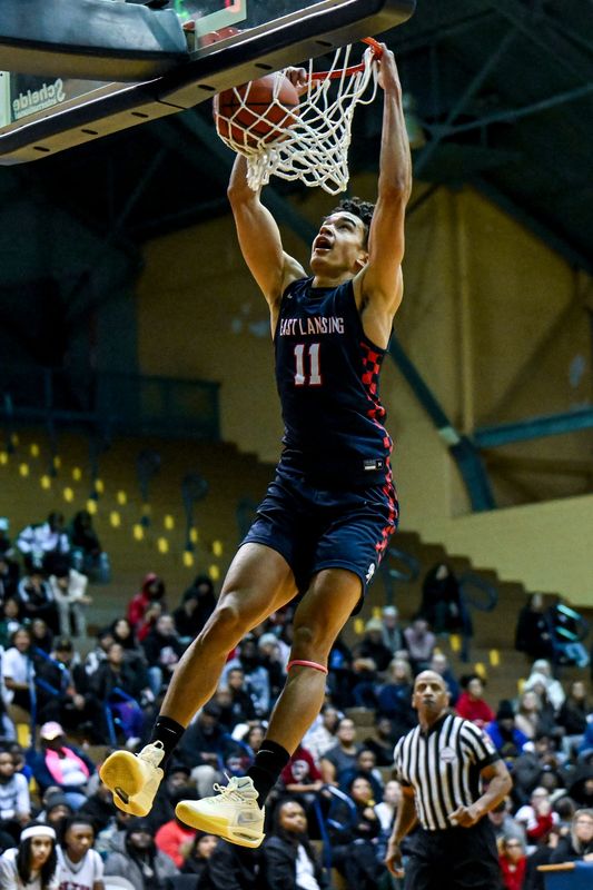 East Lansing's KT Thomas dunks against Sexton during the second quarter on Tuesday, Dec. 9, 2025, at the Don Johnson Fieldhouse in Lansing.